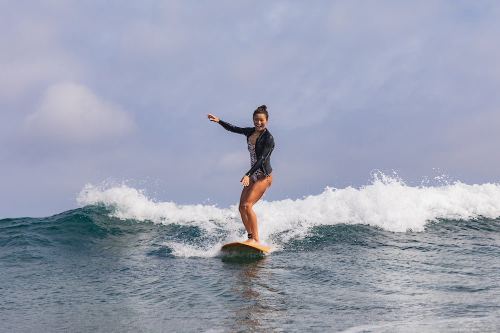 Surfer demonstrating high-performance surfing with optimized fin setup