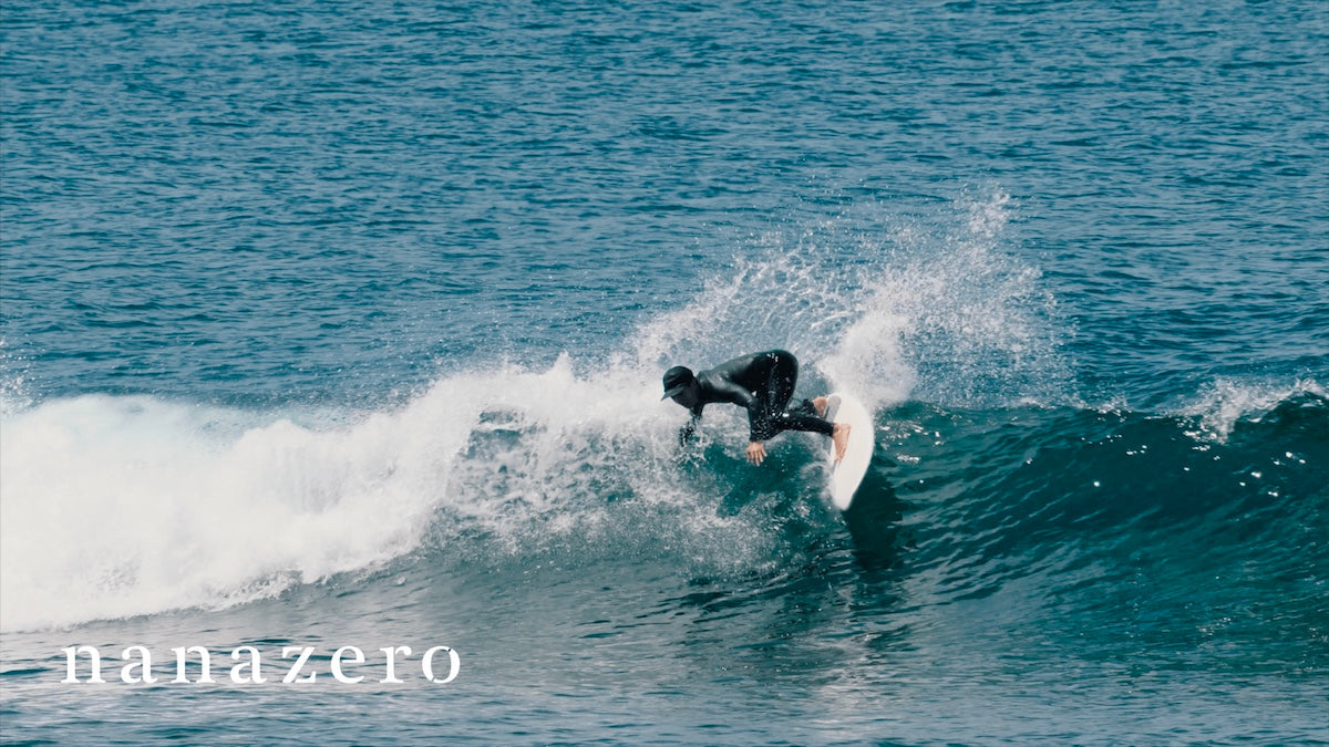 Surfer executing a powerful turn showing the effects of optimized fin cant